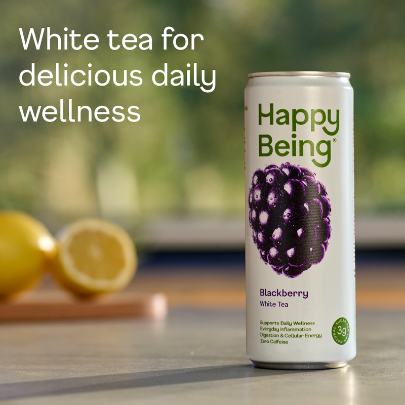 Happy Being Blackberry White Tea can with lemons on a blurred natural background