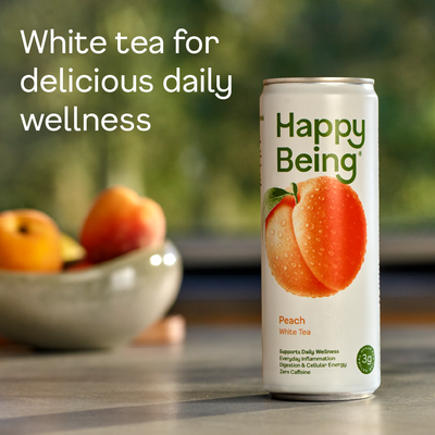 Can of Happy Being Peach White Tea with fruit in the background