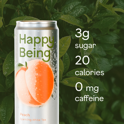 Can of 'Happy Being' peach lozenge white tea with nutritional information on a green leafy background