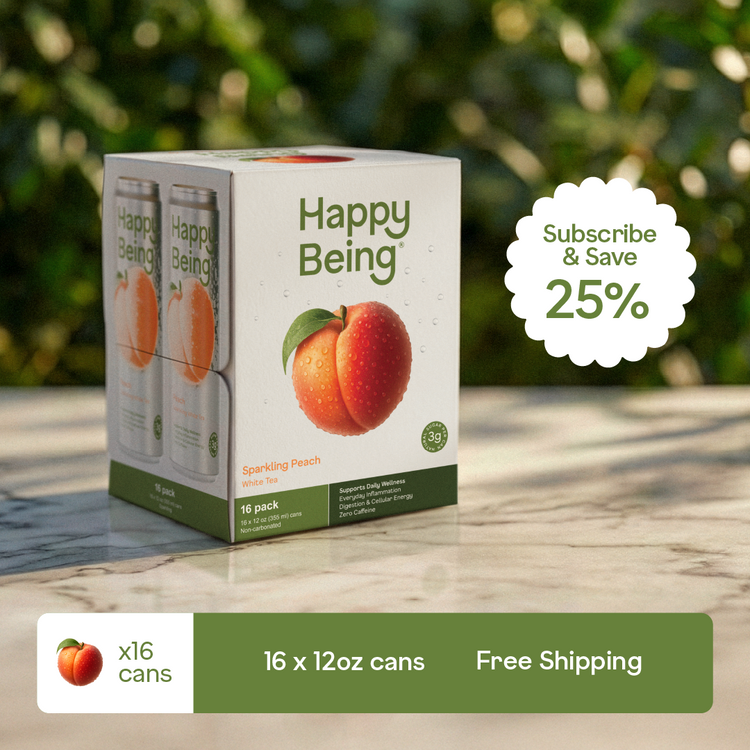 Box of Happy Being sparkling peach drinks with promotional text on a blurred natural background
