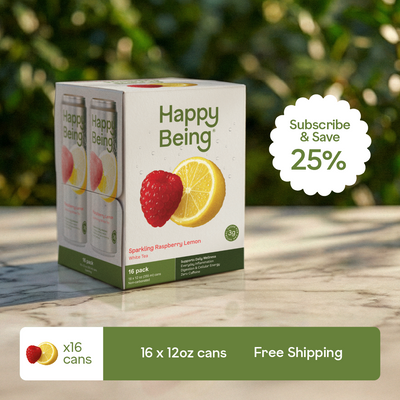 Box of Happy Being sparkling raspberry lemon drink on a wooden surface with a blurred green background