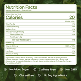 Nutrition facts label for a blueberry juice product on a green leafy background