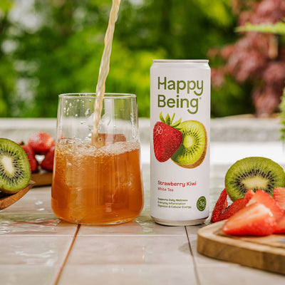 Happy Being strawberry kiwi drink poured over ice.