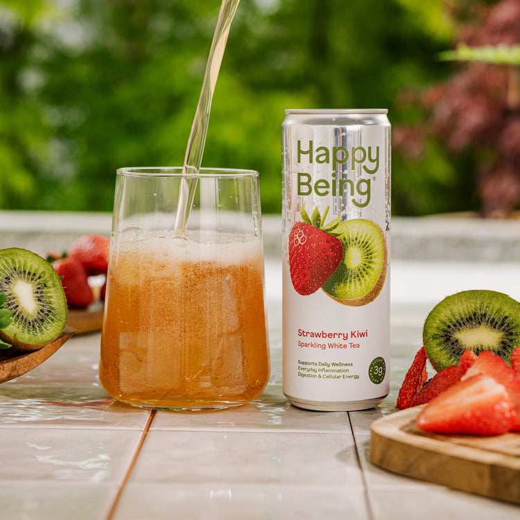 Happy Being sparkling strawberry kiwi drink poured into a glass.
