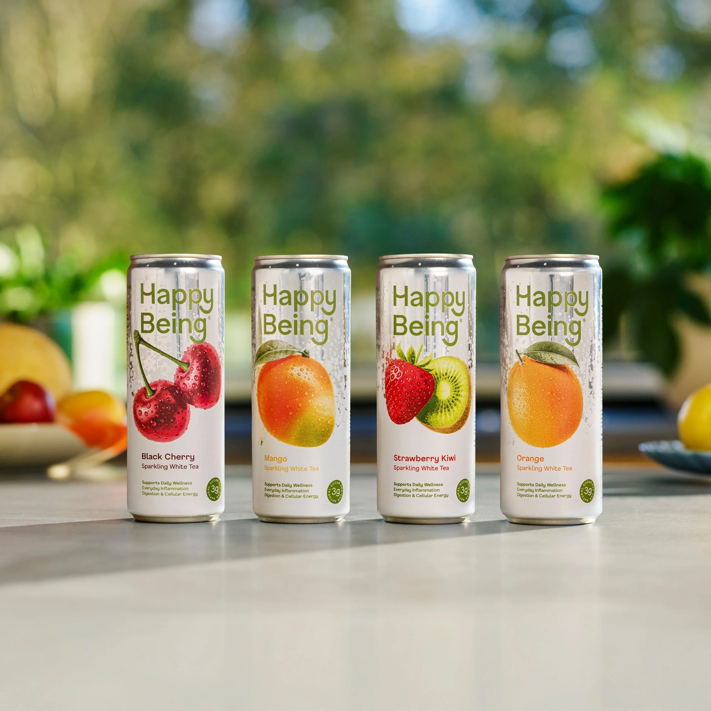 Orchard Sparkling Variety Pack featuring four Happy Being sparkling white tea flavors including Black Cherry, Orange, Strawberry Kiwi, and Mango.