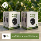 Two boxes of Happy Being Blackberry White Tea and Sparkling White Tea on a blurred green background